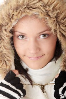 Teen woman in winter jacket with fur around her face - smile