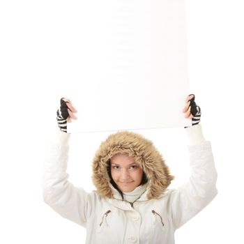 Portrait of a beautiful woman holding a blank billboard looking out from behind it. beautiful woman and blank sign