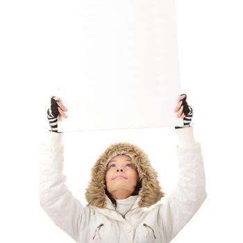 Portrait of a beautiful woman holding a blank billboard looking out from behind it. beautiful woman and blank sign