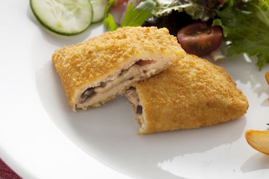 Vegetarian version of cordon bleu with mushroom and cream sauce.