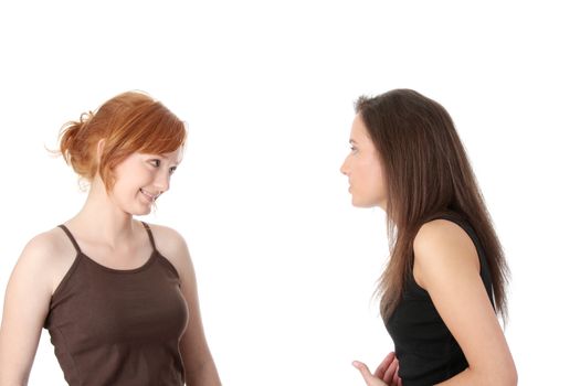 Two young womans talking isolated on white background