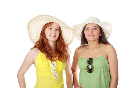 Two girlfriends in summer dress and hat over white background