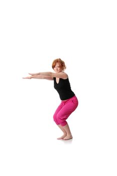 Redhead exercising yoga, isolated on white background