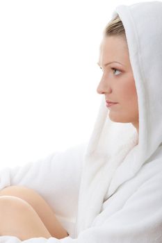 Young woman in bathrob isolated