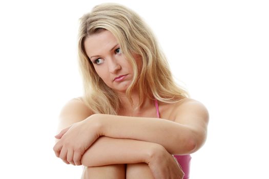 Depressed young caucasian woman, isolated on white