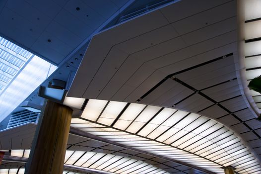 Leaf design ceiling lights and blue air well.