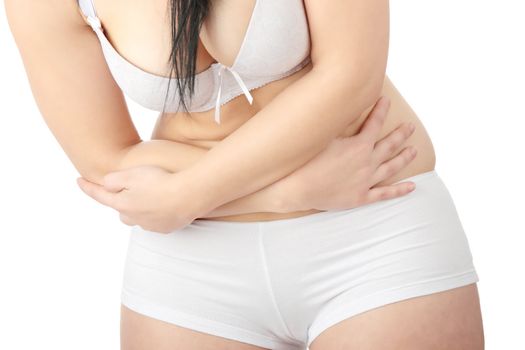 Young corpulent caucasian woman in underwear with stomach ache