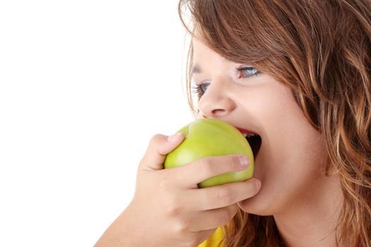 Teen girl eating grean apple isolated on white background