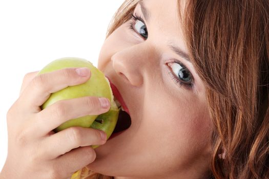 Teen girl eating grean apple isolated on white background