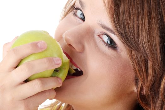 Teen girl eating grean apple isolated on white background