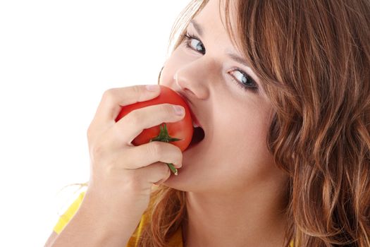 Young woman eating tomato isolated on white background