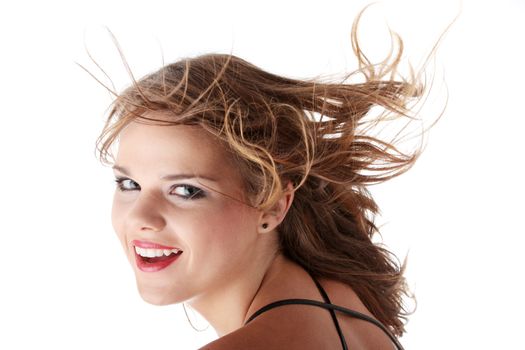Young teen woman with wind in her hair isolated on white background
