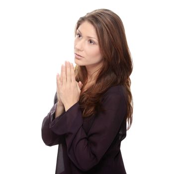 Closeup portrait of a young caucasian woman praying
