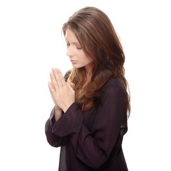 Closeup portrait of a young caucasian woman praying