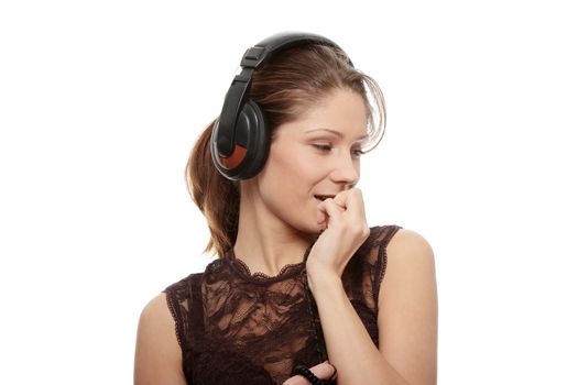 Listening to the Music, young caucasian beautiful woman with headphones, isolated on white background