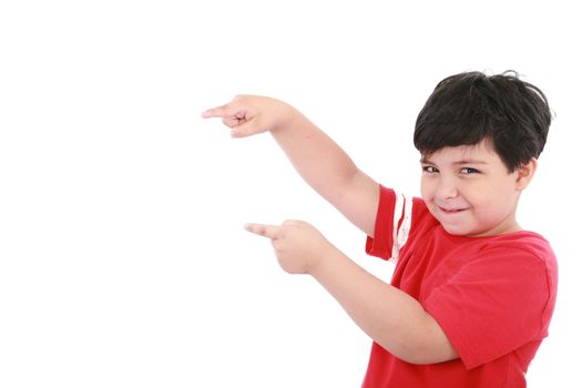 A little boy points at something, boy presents something