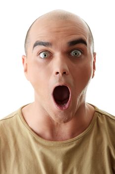 Closeup portrait of a shocked young man looking straight on a white background