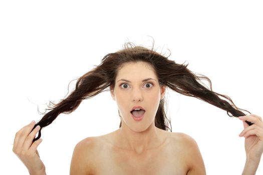 Front view of beauty and sexy woman holding her hairs