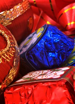 Chocolates and Christmas ornaments macro shot