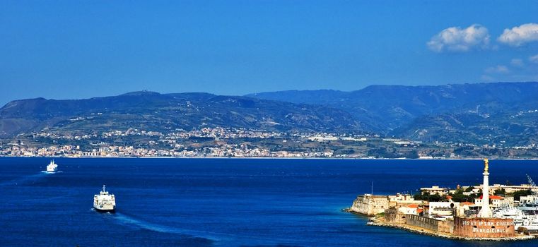 View of Messina strait with ferries and port