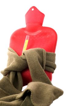 Hot-water bottle with scarf and thermometer isolatd on white