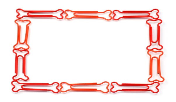 Colored bone-shaped paper clips isolated on white forming a frame