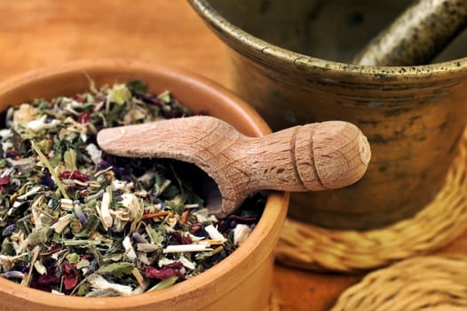 Mortar and bowl with herbs with selective focus