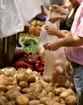 street market, vegetables and fruits, a person buying