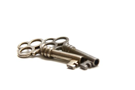 Isolated shot of two metal antique keys on white background