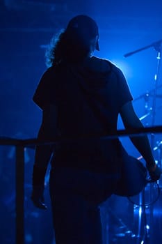 Guitarist on a stage in music club