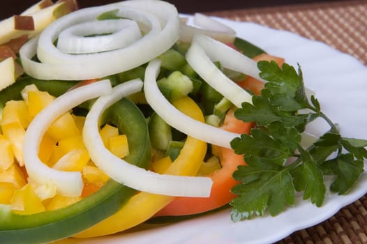 Vegetable salad from pepper and an onions