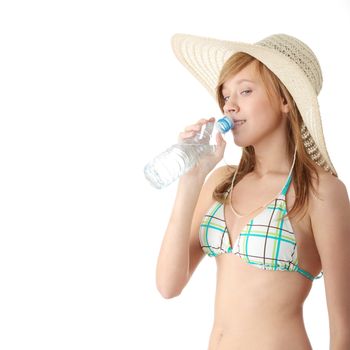 Summer girl with bottle of mineral water,isolated on white background