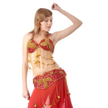 Teen girl in belly dancer costume dancing, isolated on white background