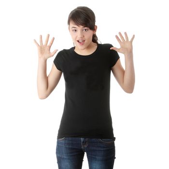 Teen girl with hands up portrait, over white background