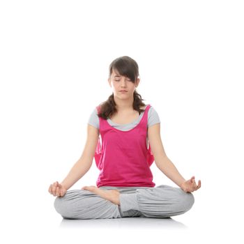 Teen woman training yoga, isolated on white
