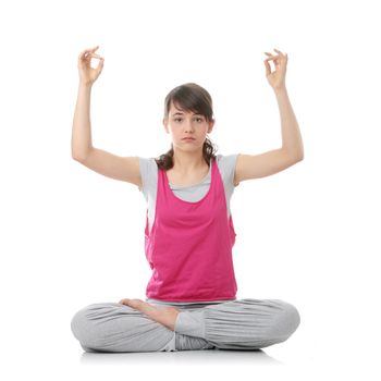 Teen woman training yoga, isolated on white