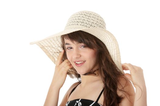 Happy teen girl in dress and summer hat, over white background
