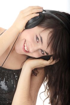 Young beautiful happy women listening music in headphones