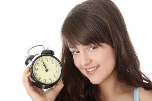 A teen woman with alarm clock isolated on white background