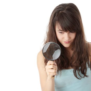 Teen student girl with magnifier, isolated on white background