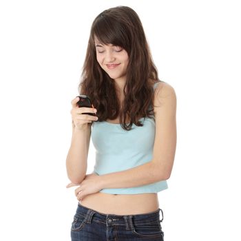 Teen caucasian woman using a mobile phone isolated on white background