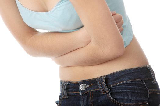 Young teen woman with stomach ache isolated on white background