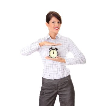 A young business woman with alarm clock isolated
