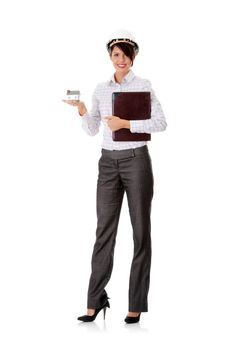 Young businesswoman holding house model, isolated on white background
