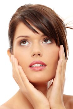 Beautiful woman's face with fresh clean skin isolated on white