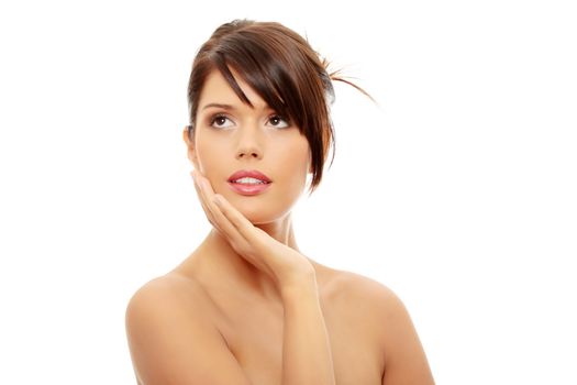 Beautiful woman's face with fresh clean skin isolated on white