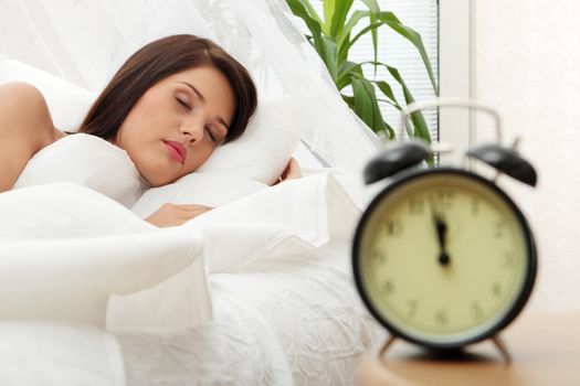 Beautiful Caucasian woman waking up in the morning.