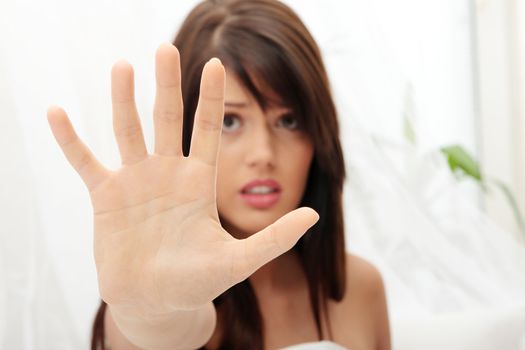 Young beautiful caucasian woman in bed abused