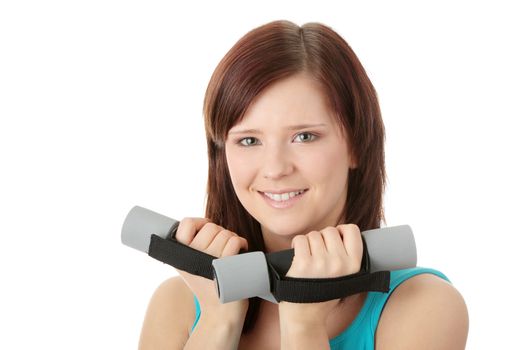 Portrait of beautiful smiling girl with dumbbells.