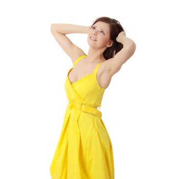Beautiful brunette girl in yellow dress. Isolated on white background